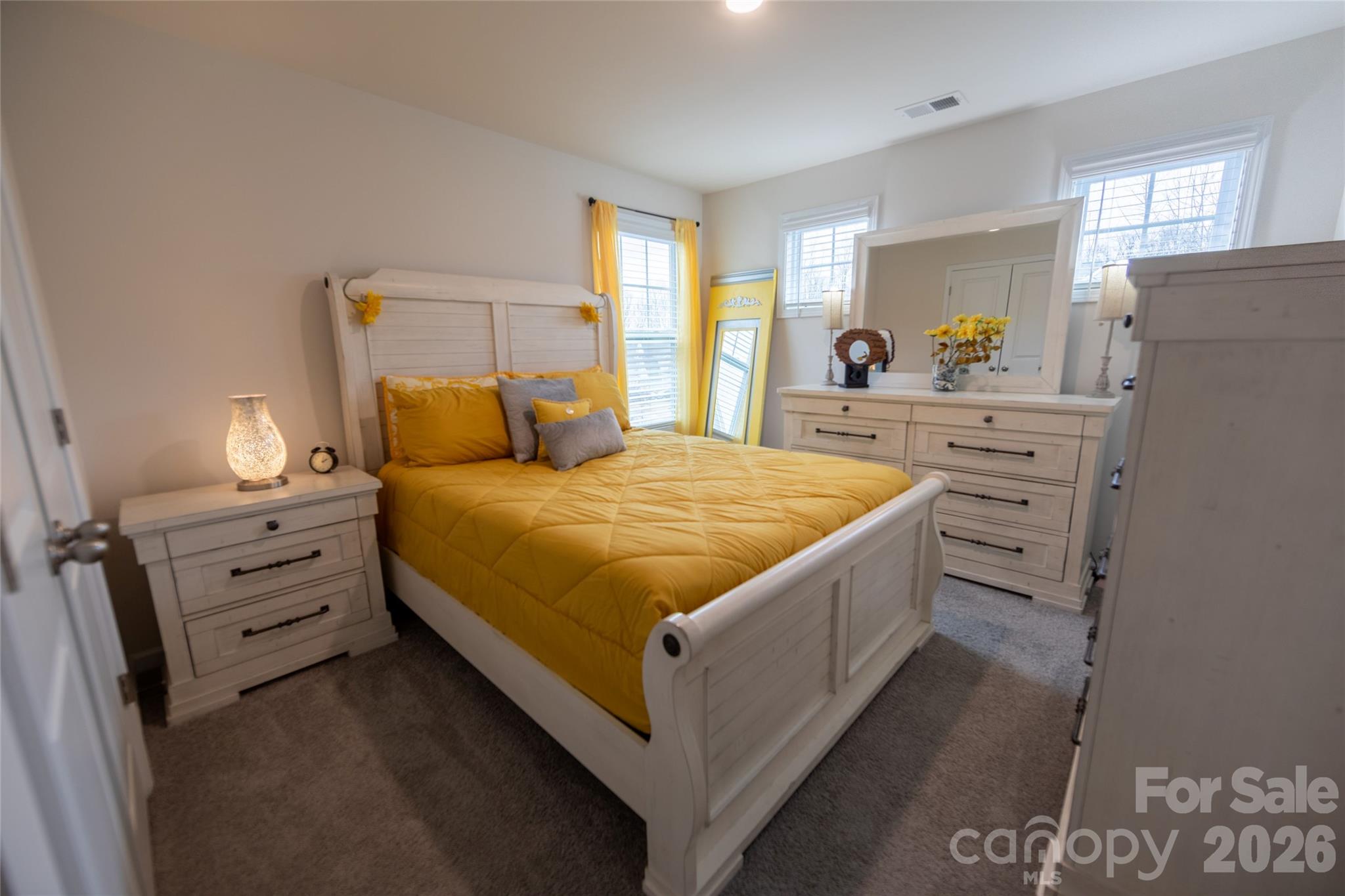 151 Aviendha Lane Troutman, NC 28166 - Photo 30 of 43 a bed room with a bed and a dresser