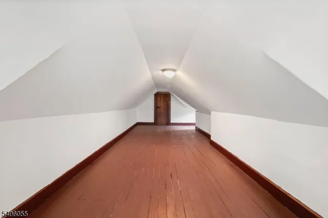 a view of a hallway with stairs