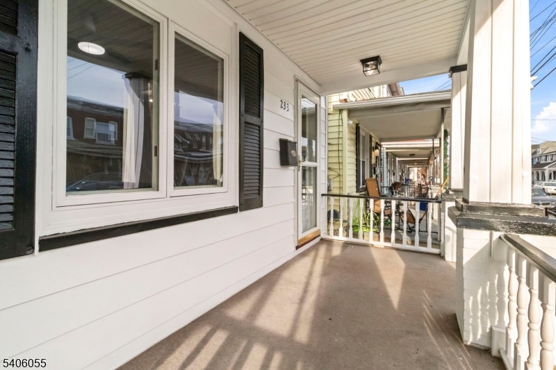 233 Irwin Street Phillipsburg, NJ 08865 - Photo 26 of 33 a view of a porch with a table and chairs