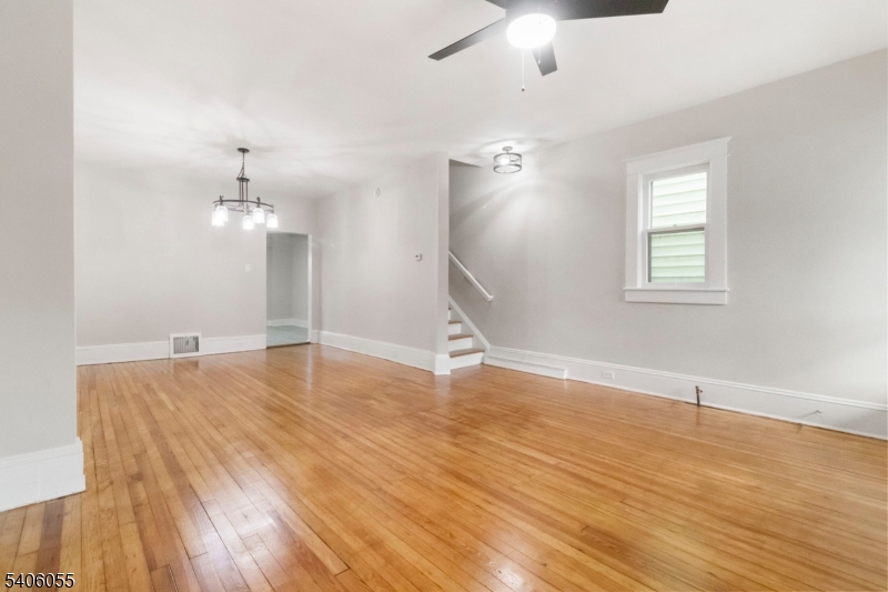 233 Irwin Street Phillipsburg, NJ 08865 - Photo 4 of 33 wooden floor in an empty room with a window
