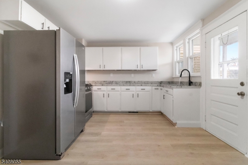 233 Irwin Street Phillipsburg, NJ 08865 - Photo 9 of 33 a kitchen with stainless steel appliances granite countertop a refrigerator sink and cabinets