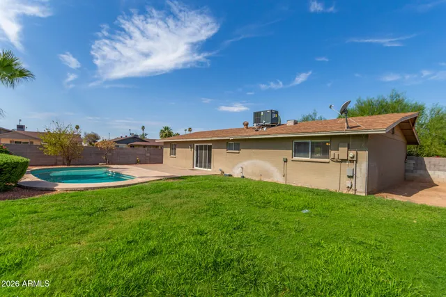 a backyard of a house with lots of green space