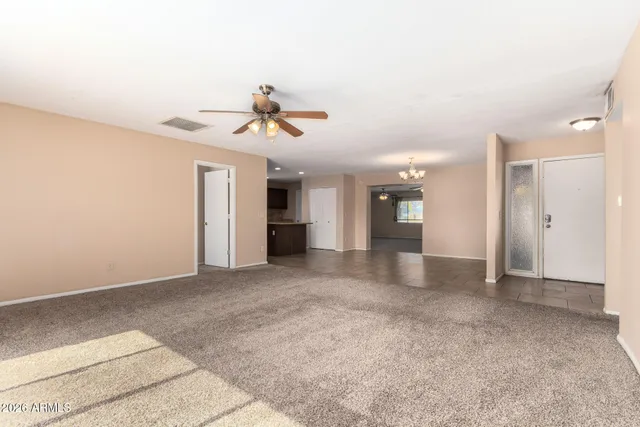 a view of a kitchen with a sink and a refrigerator