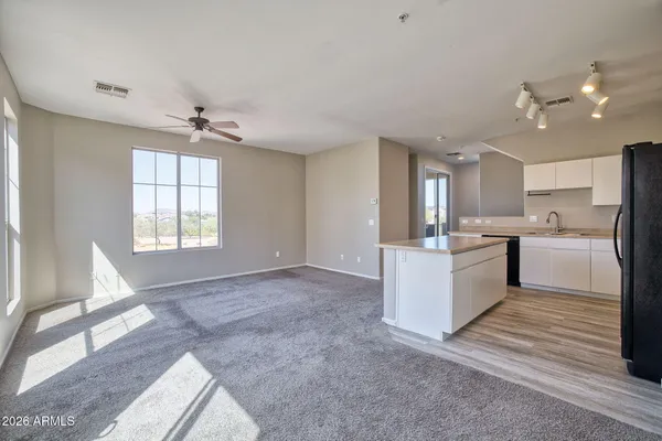 a view of an empty room with a window