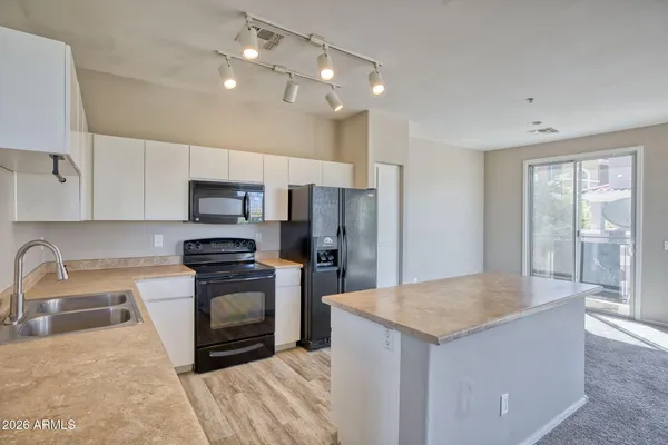 a view of a kitchen with a sink cabinets and a kitchen