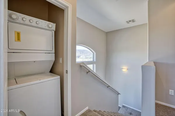 a bathroom with a tub shower vanity and a sink