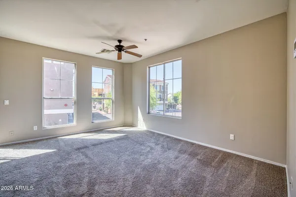 a view of a hallway with wooden floor and closet