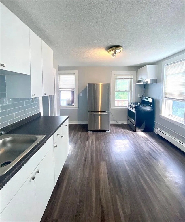 15 Shurtleff Street Chelsea, MA 02150 - Photo 3 of 9 a kitchen with refrigerator and window