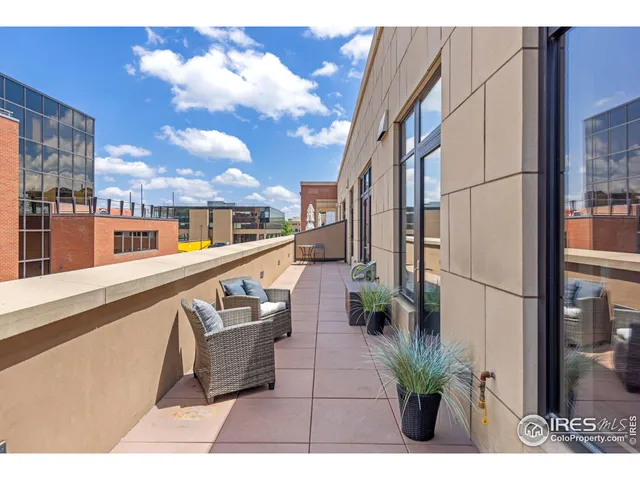 a view of balcony with furniture