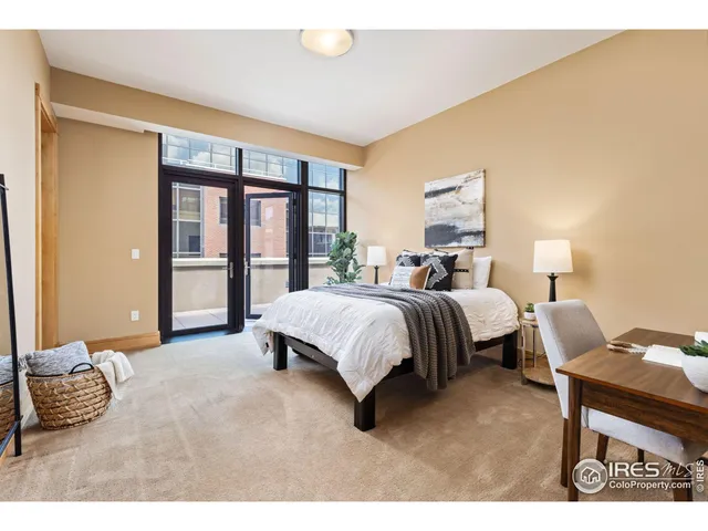 a bed room with a bed and a lamp