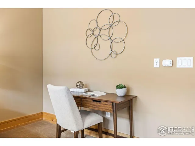 a bathroom with a granite countertop sink a toilet and a mirror