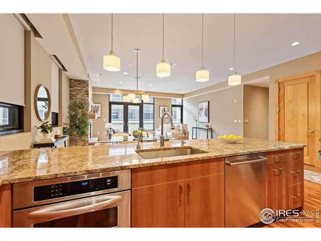 a kitchen with stainless steel appliances granite countertop a sink and cabinets