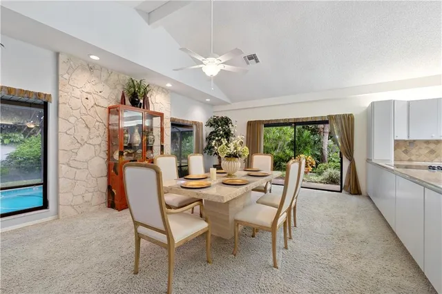 a view of a dining room with furniture window and outside view