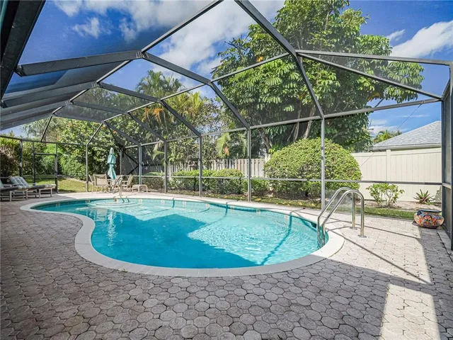 a view of a swimming pool with a patio