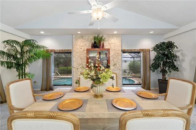 a kitchen with furniture and potted plants