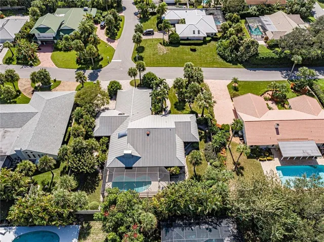 an aerial view of house with yard swimming pool and outdoor seating