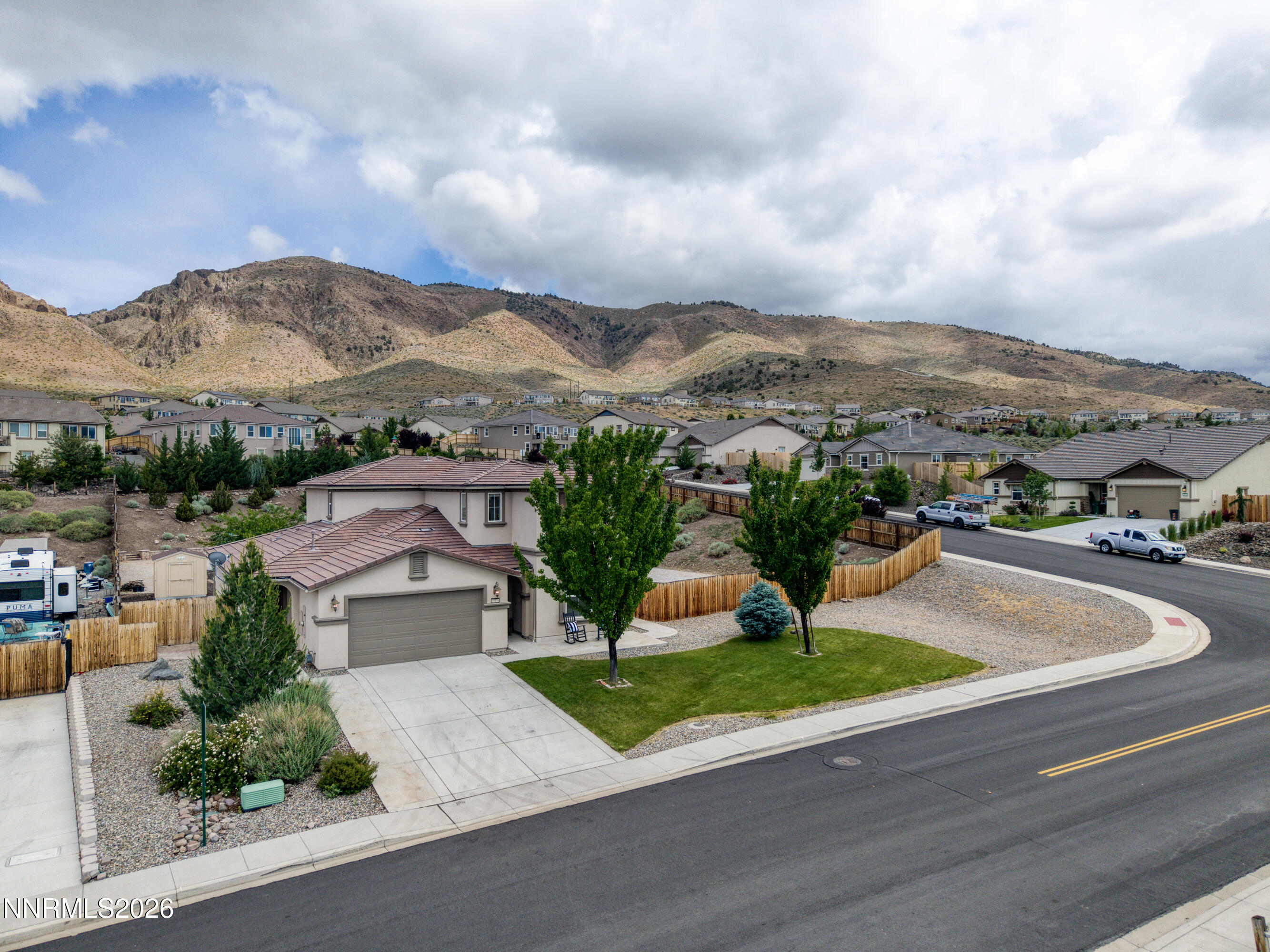 10150 Barrel Racer Drive Reno, NV 89521 - Photo 61 of 64 a view of a street with a houses in the background