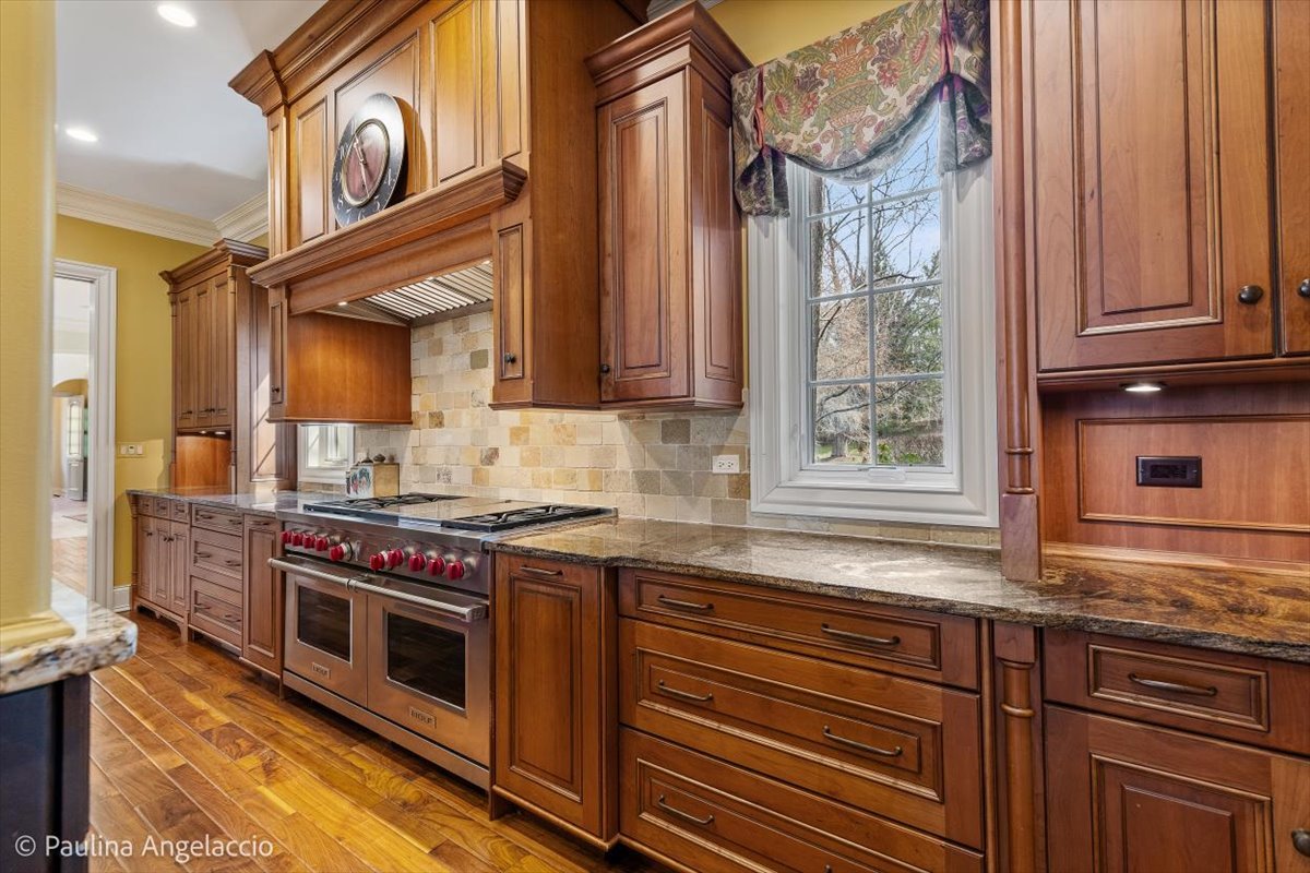 419 North Valley Hill Road Bull Valley, IL 60098 - Photo 18 of 95 a kitchen with stainless steel appliances granite countertop a stove and a sink