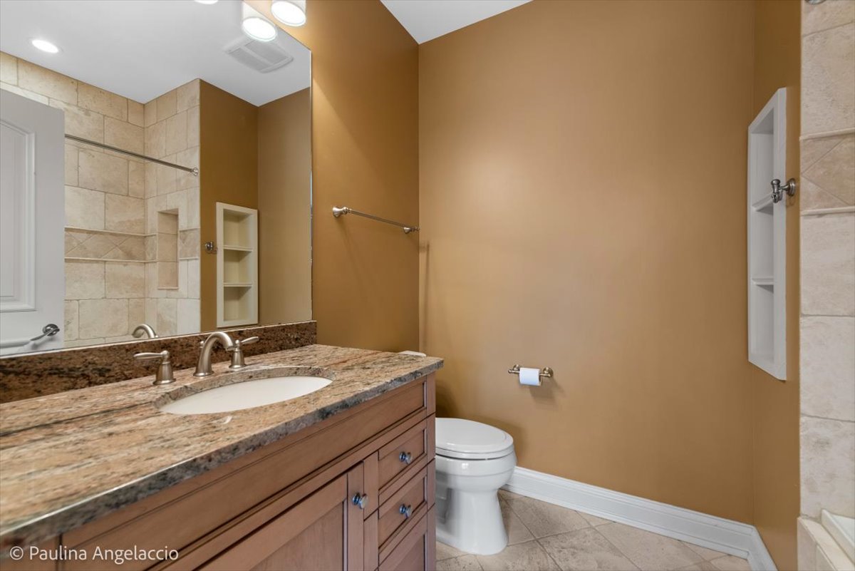 419 North Valley Hill Road Bull Valley, IL 60098 - Photo 50 of 95 a bathroom with a granite countertop sink a toilet and a mirror
