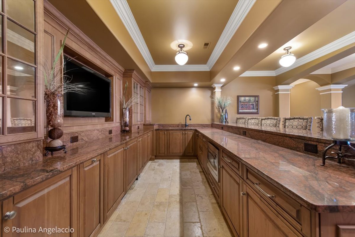 419 North Valley Hill Road Bull Valley, IL 60098 - Photo 61 of 95 a large kitchen with a large counter top a sink a window and stainless steel appliances
