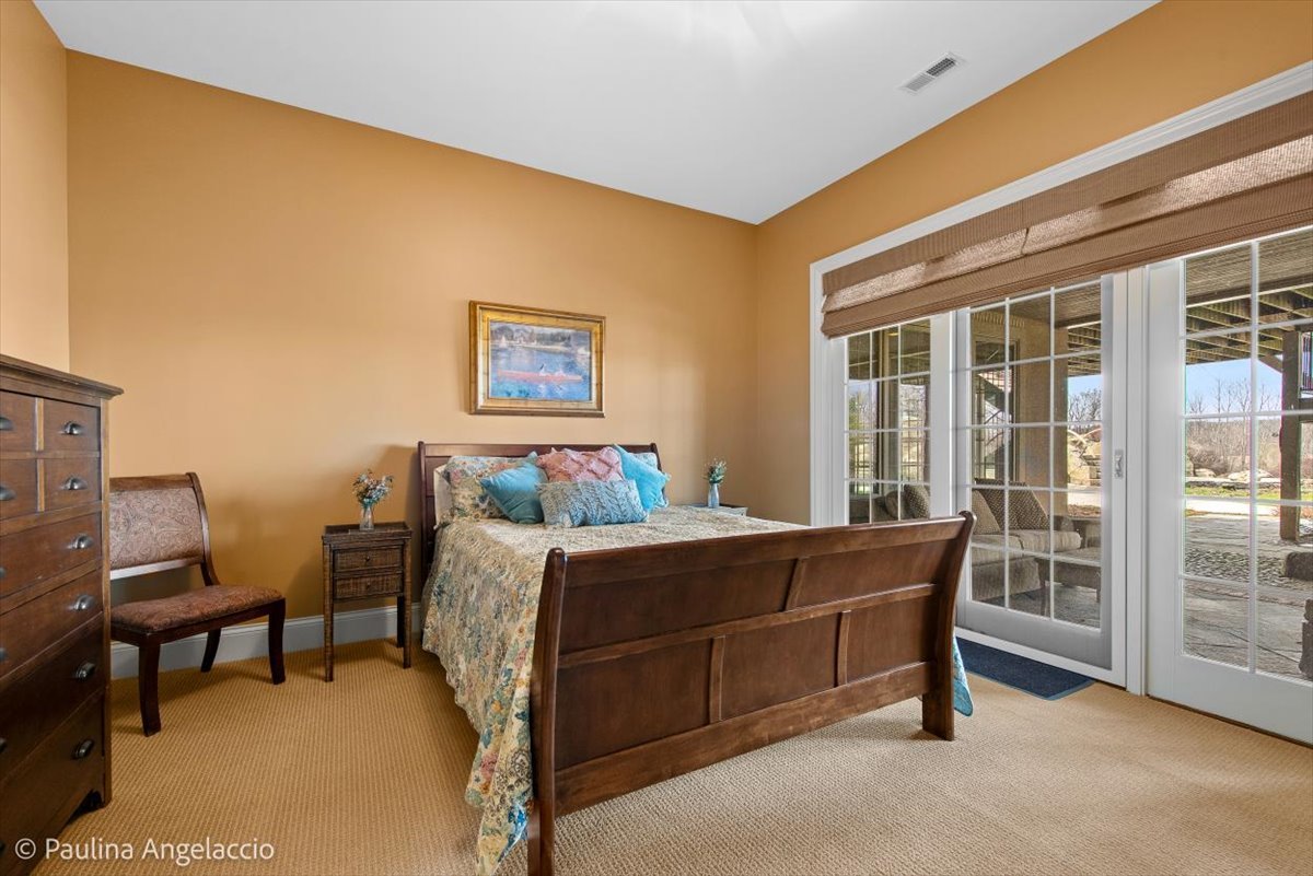 419 North Valley Hill Road Bull Valley, IL 60098 - Photo 65 of 95 a bed room with a bed and a chair