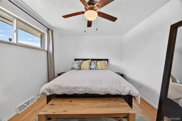 a bedroom with a bed and window