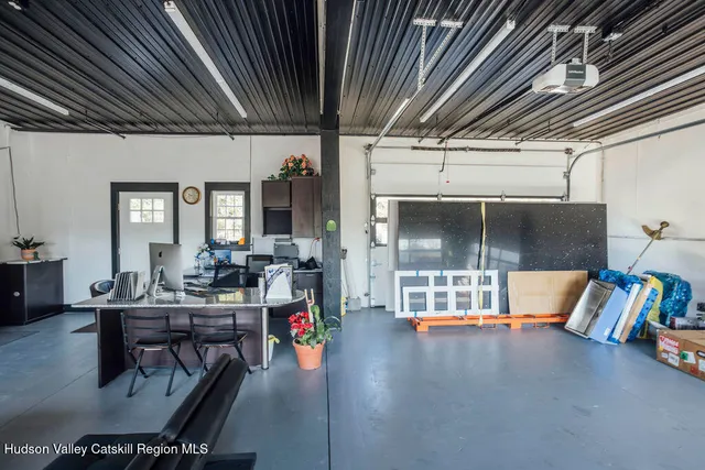 a dining room with furniture and a chandelier