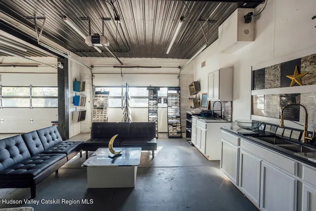 a living room with furniture and flat screen tv
