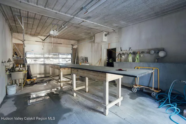 a room with gym equipment and a large window