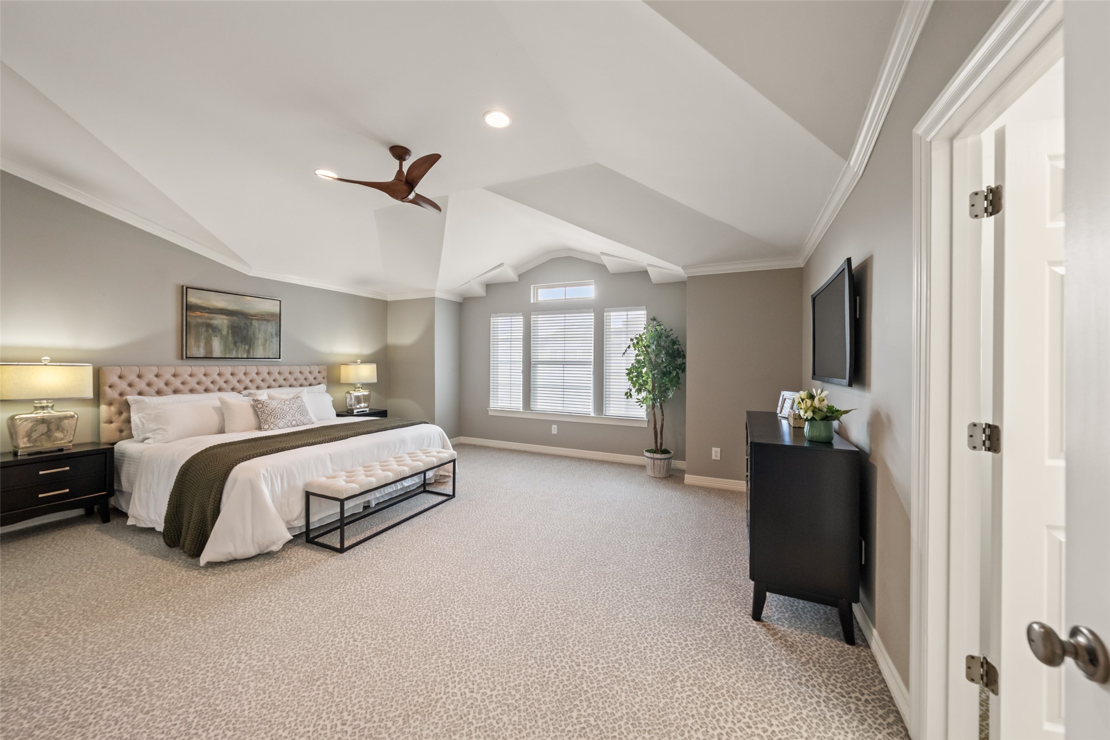 2708 Wroxton Road West University Place, TX 77005 - Photo 16 of 22 Spacious primary bedroom suite with elegant design and abundant natural light.