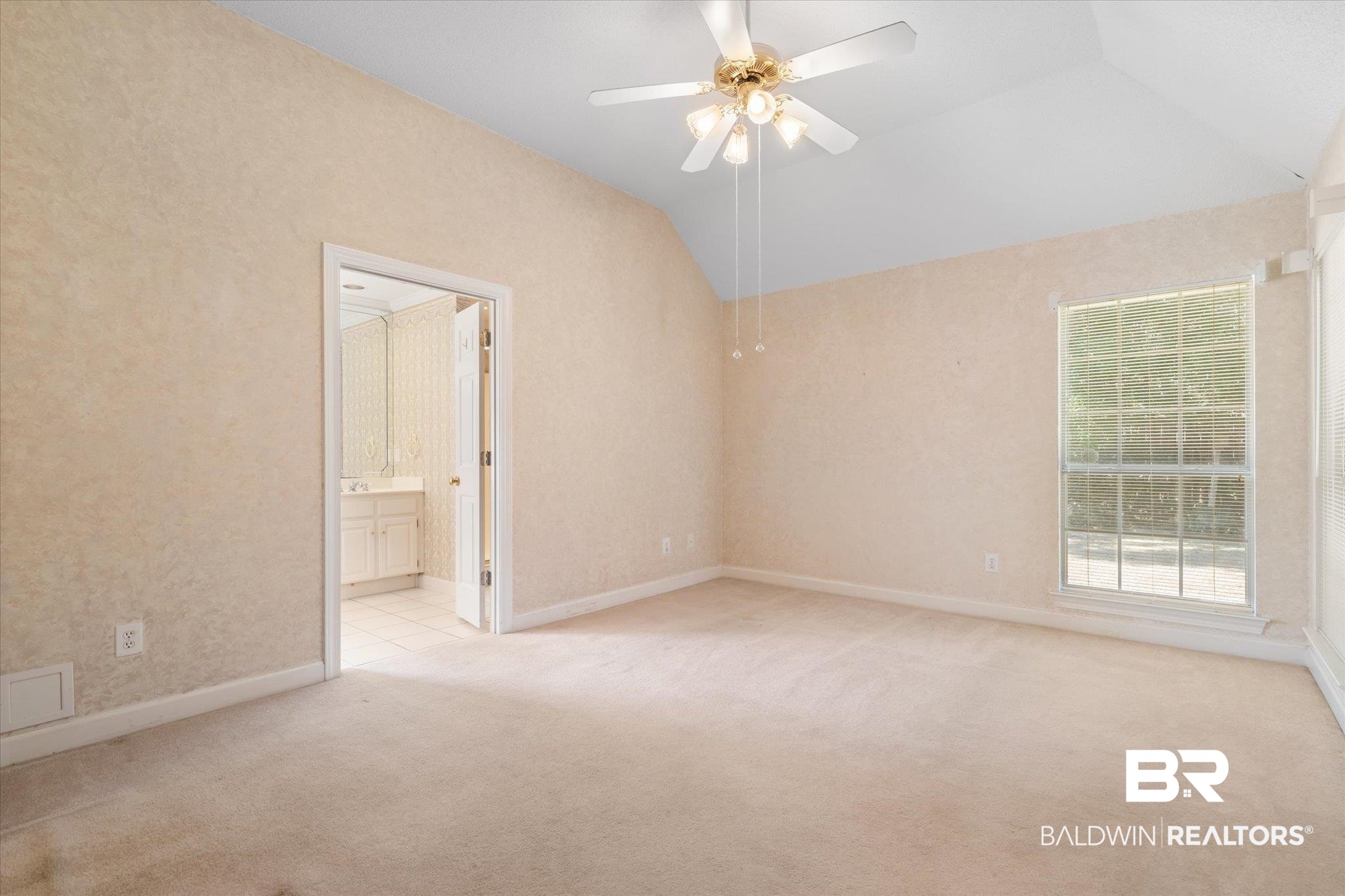 2220 Irongate Court Mobile, AL 36695 - Photo 10 of 20 Unfurnished room with lofted ceiling, visible vents, light carpet, ceiling fan, and baseboards