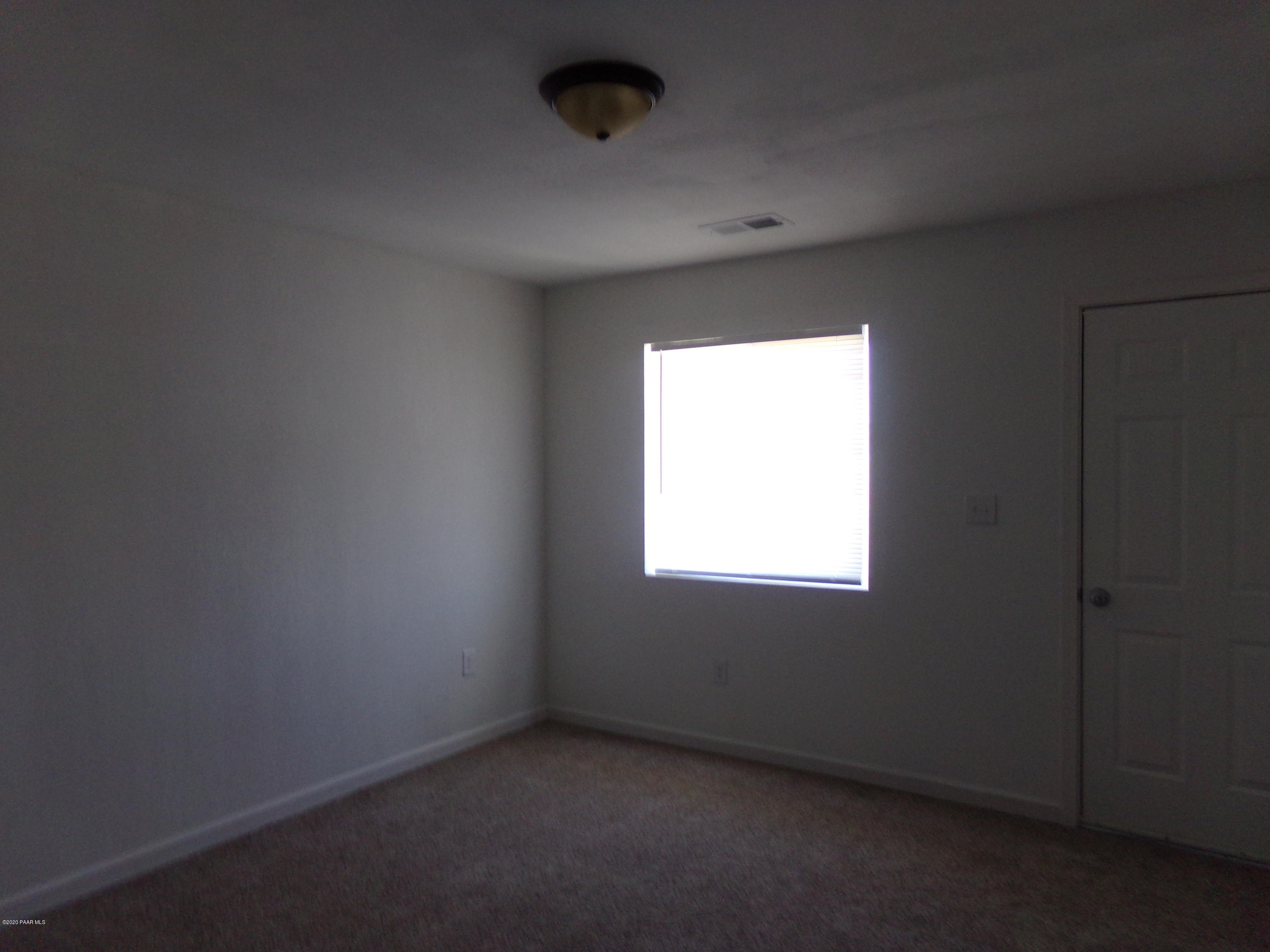 3100 Bob Court, Unit 2 Prescott Valley, AZ 86314 - Photo 5 of 10 an empty room with a window