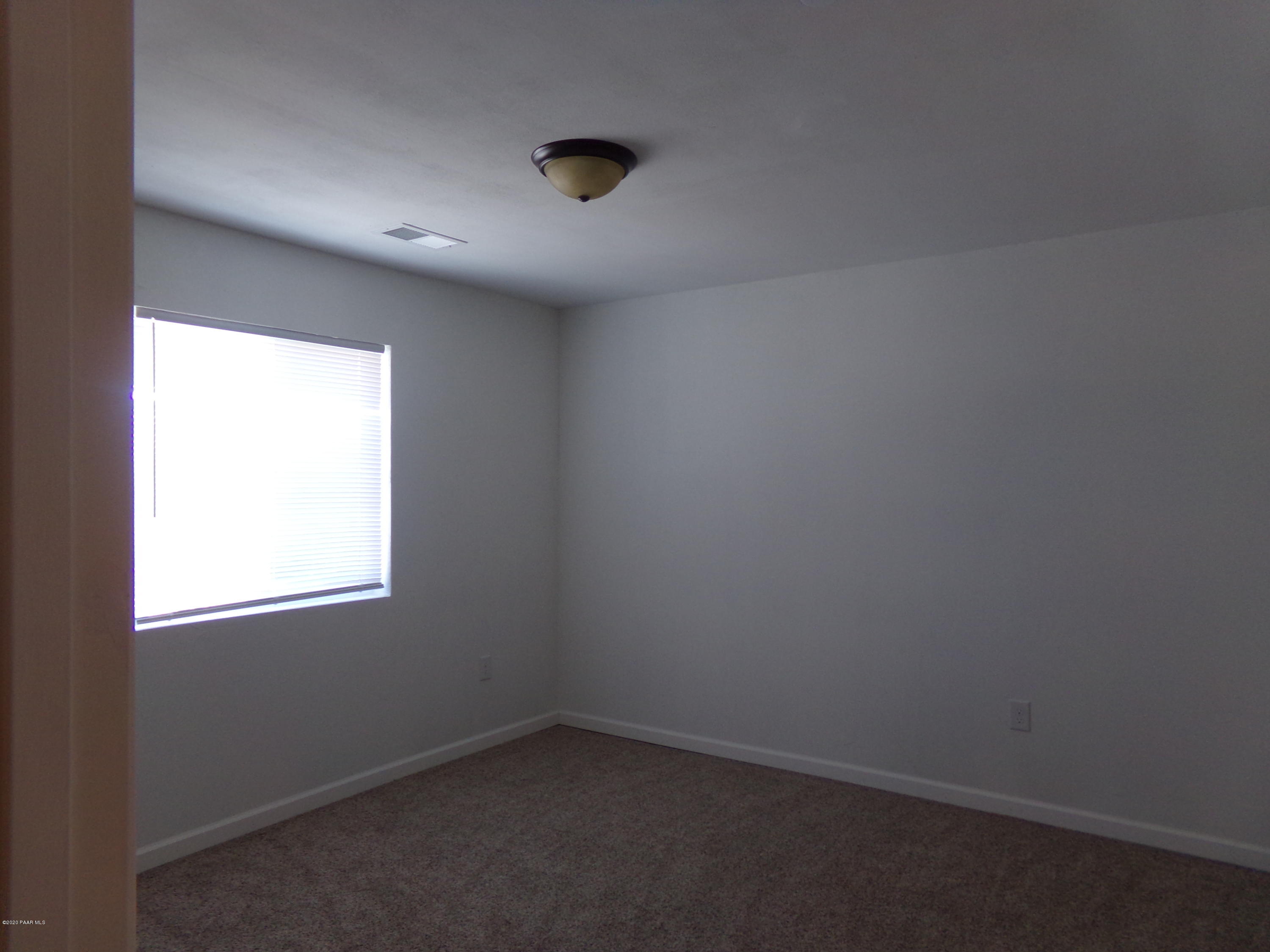 3100 Bob Court, Unit 2 Prescott Valley, AZ 86314 - Photo 8 of 10 an empty room with a window