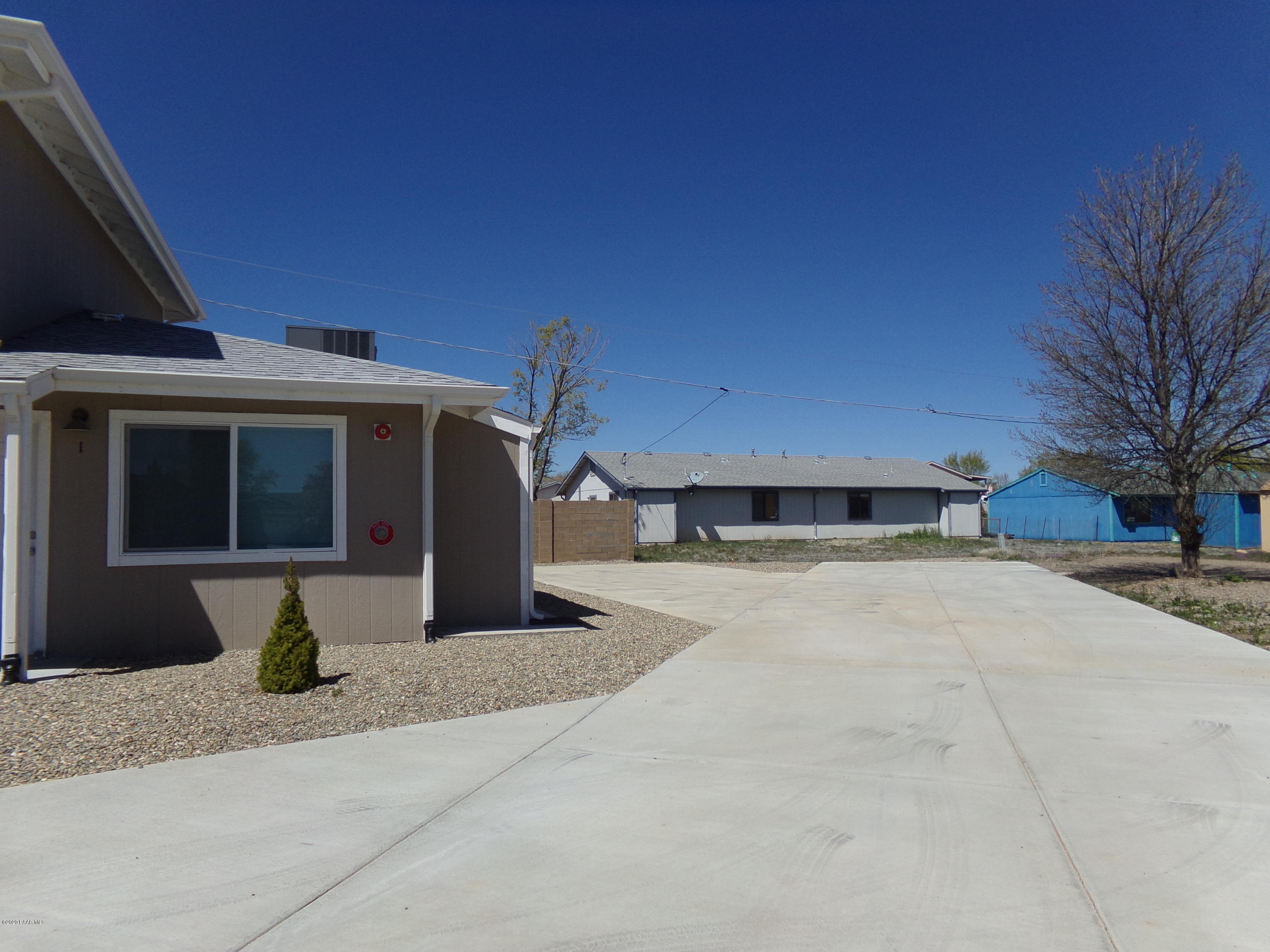 3100 Bob Court, Unit 2 Prescott Valley, AZ 86314 - Photo 10 of 10 a front view of a house with a yard