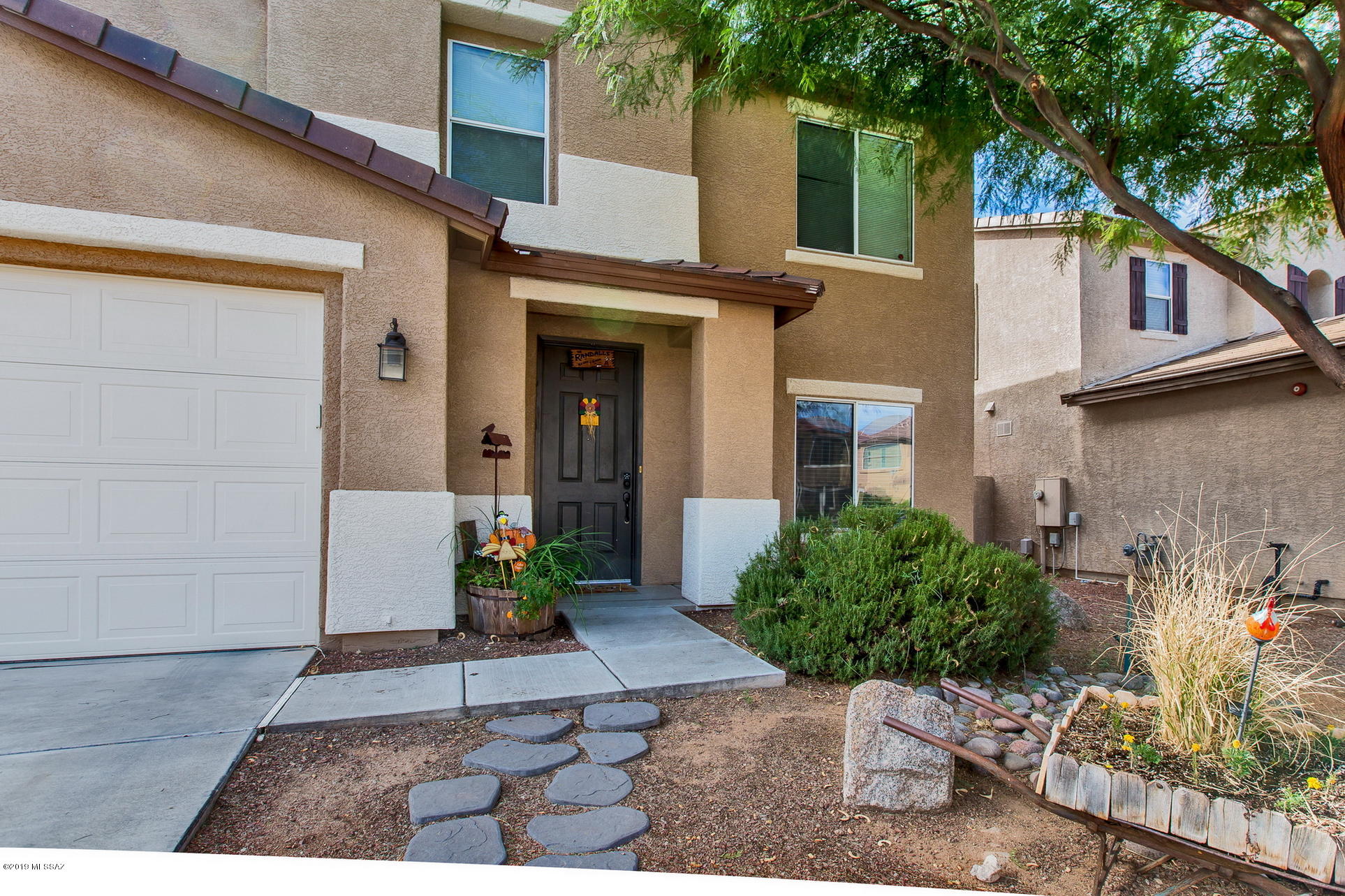 3600 East Mecate Road Tucson, AZ 85739 - Photo 2 of 39 a view of a house with a yard and sitting area