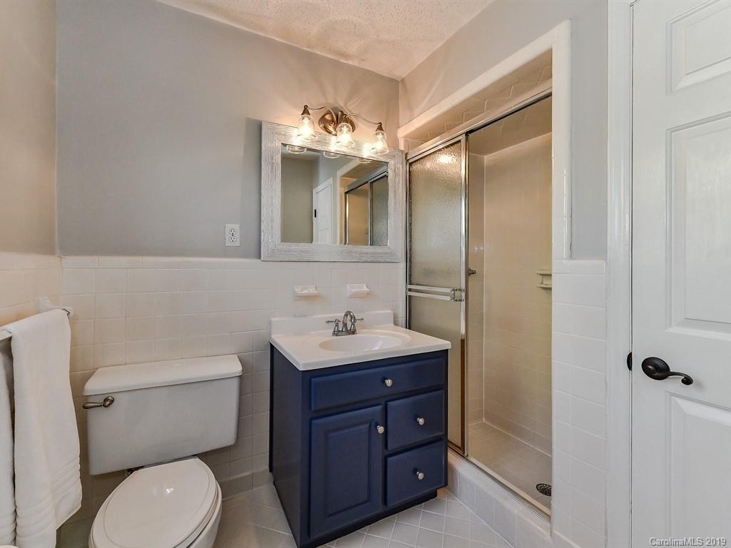5300 Guildbrook Road Charlotte, NC 28226 - Photo 16 of 35 a bathroom with a toilet sink and mirror