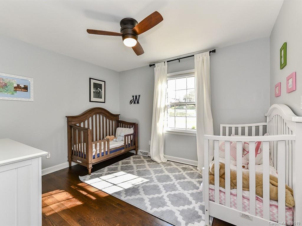 5300 Guildbrook Road Charlotte, NC 28226 - Photo 18 of 35 a view of a bedroom with wooden floor & a window