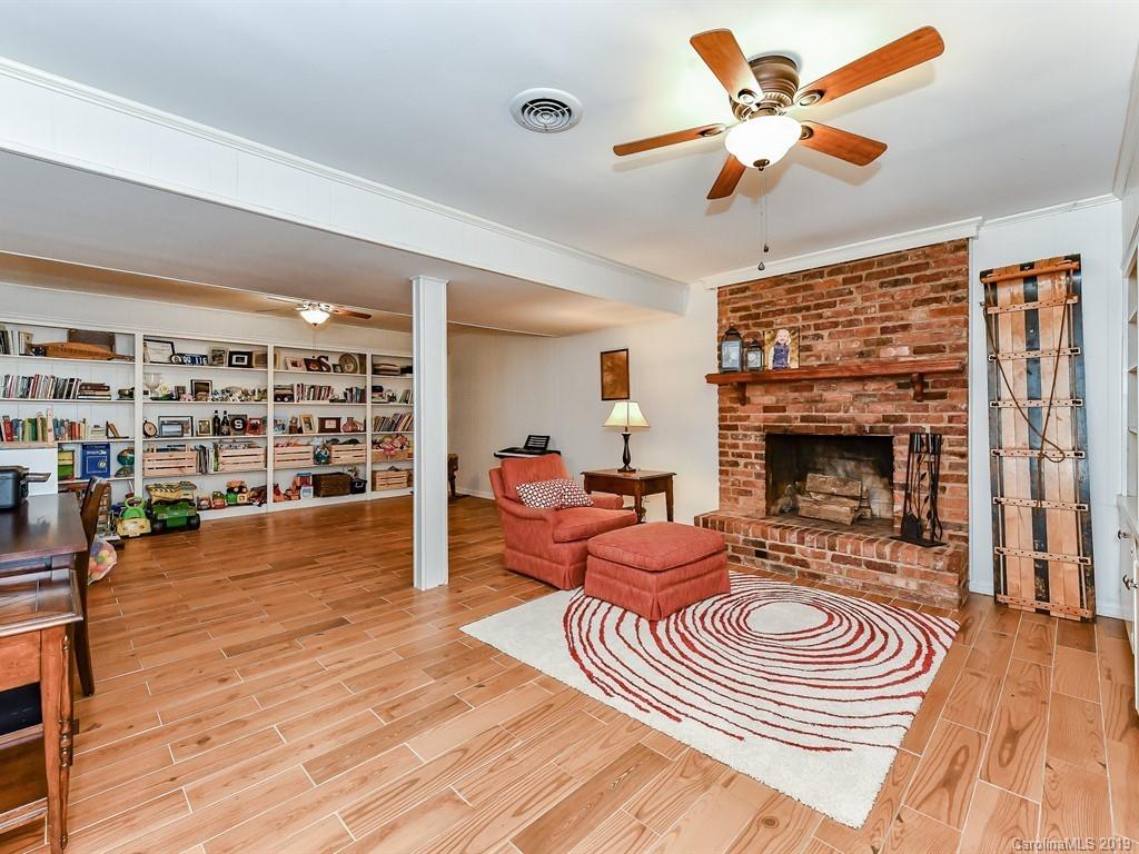 5300 Guildbrook Road Charlotte, NC 28226 - Photo 22 of 35 a living room with furniture and a fireplace