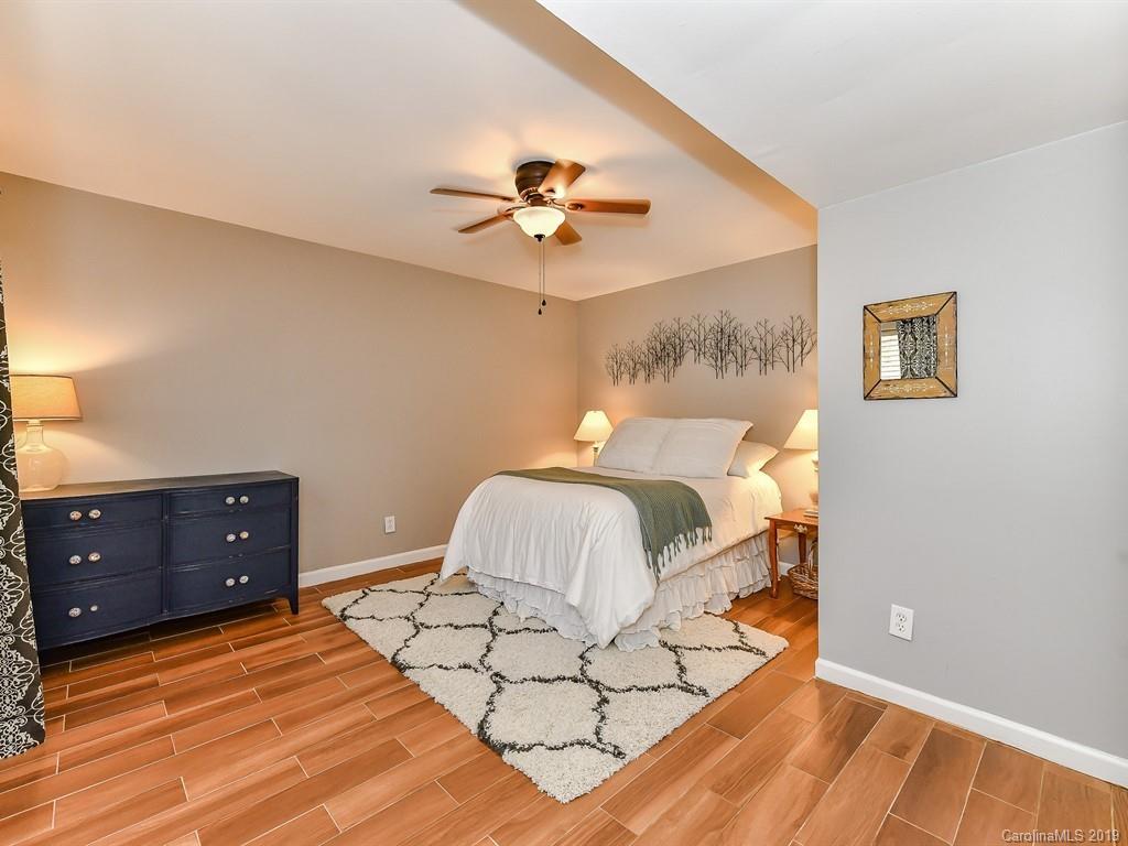 5300 Guildbrook Road Charlotte, NC 28226 - Photo 23 of 35 a bedroom with a bed and a painting on the wall