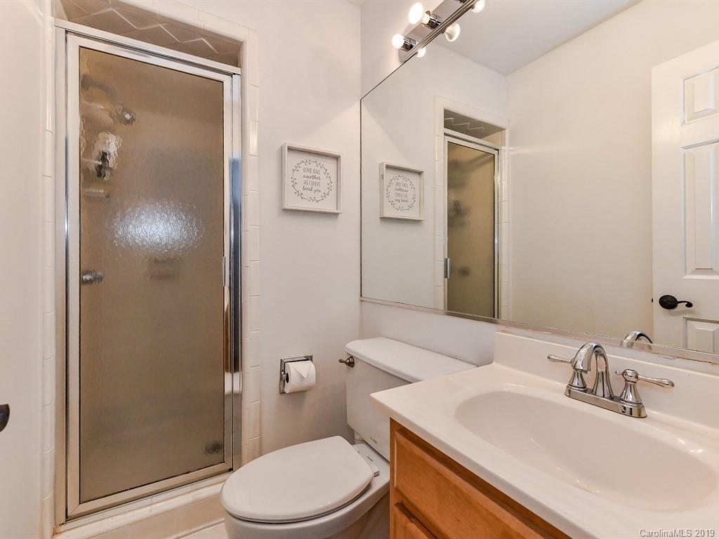 5300 Guildbrook Road Charlotte, NC 28226 - Photo 24 of 35 a bathroom with a sink toilet and shower
