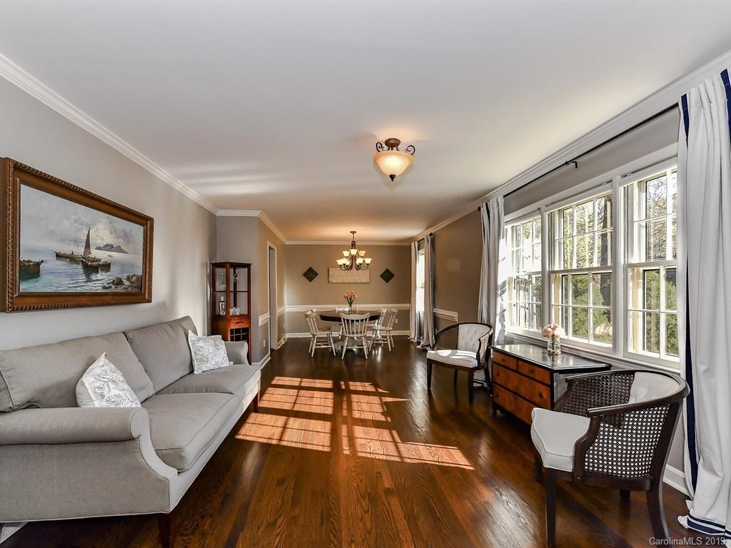 5300 Guildbrook Road Charlotte, NC 28226 - Photo 5 of 35 a living room with furniture and floor to ceiling windows