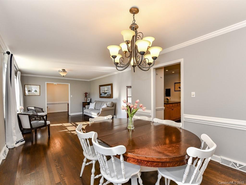 5300 Guildbrook Road Charlotte, NC 28226 - Photo 8 of 35 a view of a dining room with furniture wooden floor and chandelier