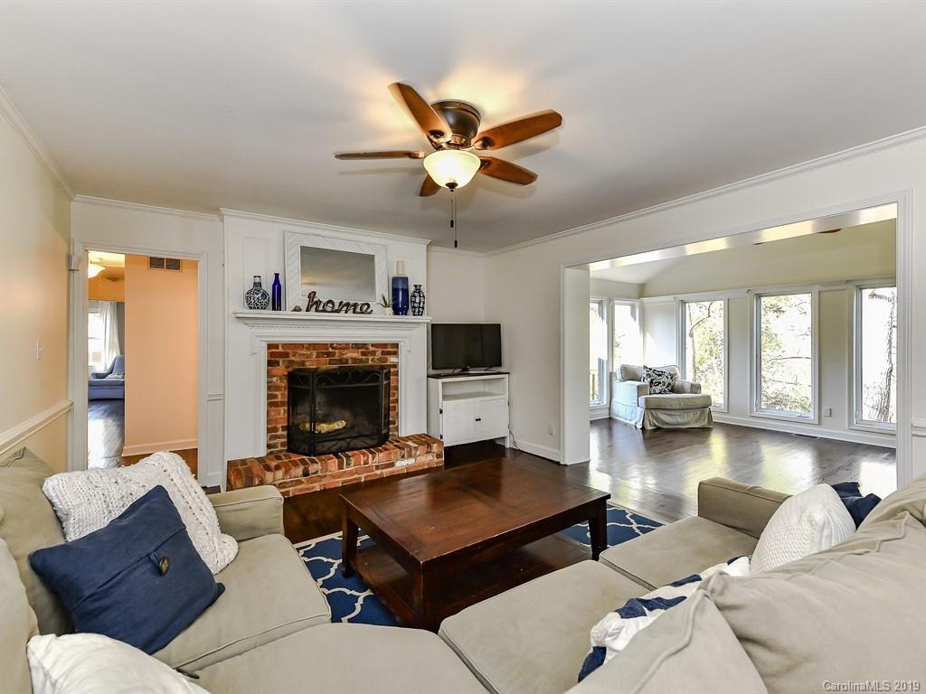5300 Guildbrook Road Charlotte, NC 28226 - Photo 10 of 35 a living room with furniture ceiling fan and a fireplace