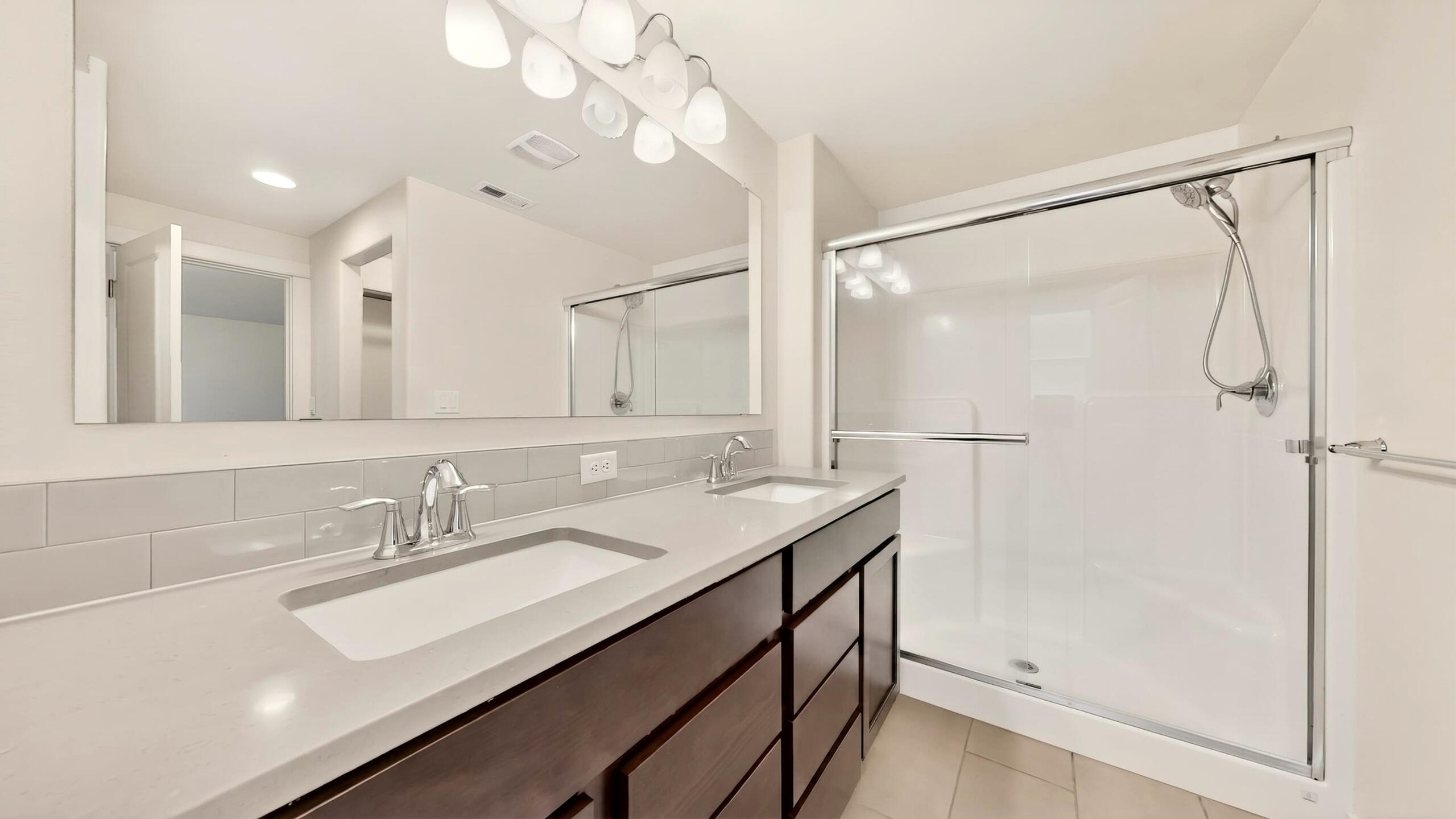 680 McKinney Ranch Road Sisters, OR 97759 - Photo 31 of 41 a bathroom with a sink vanity granite shower and a mirror
