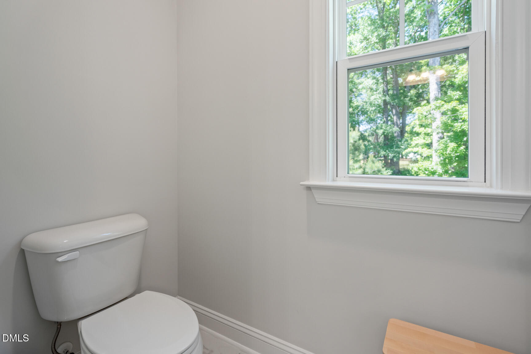 2966 Rise And Shine Road Apex, NC 27502 - Photo 35 of 61 a white toilet sitting next to a window
