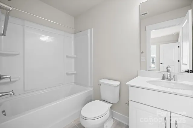 a bathroom with a sink a toilet and a bathtub