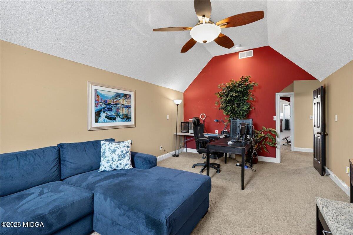 518 River Overlook Forsyth, GA 31029 - Photo 39 of 96 a living room with furniture and a chandelier