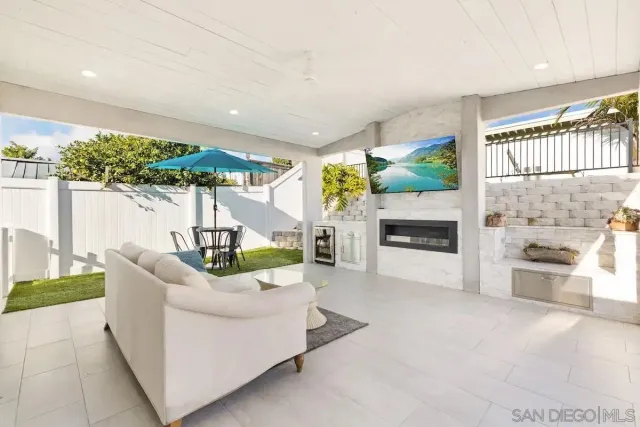 a living room with fireplace furniture and a fireplace
