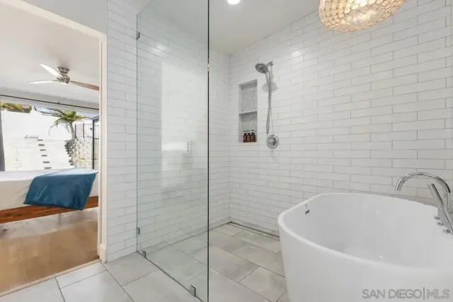 a bathroom with a bathtub and shower
