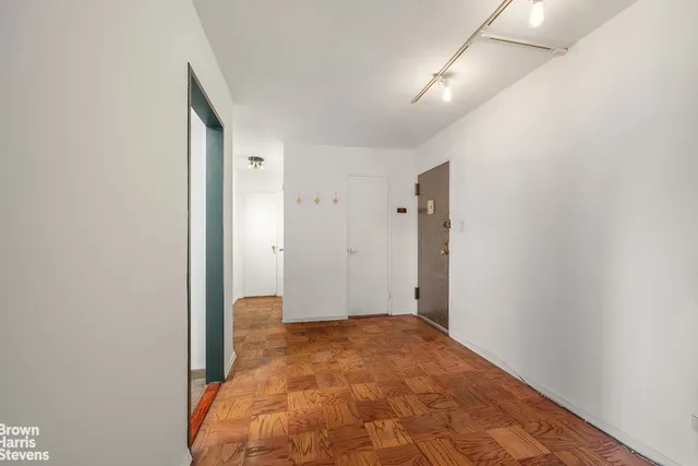 a kitchen with granite countertop a sink stainless steel appliances and cabinets